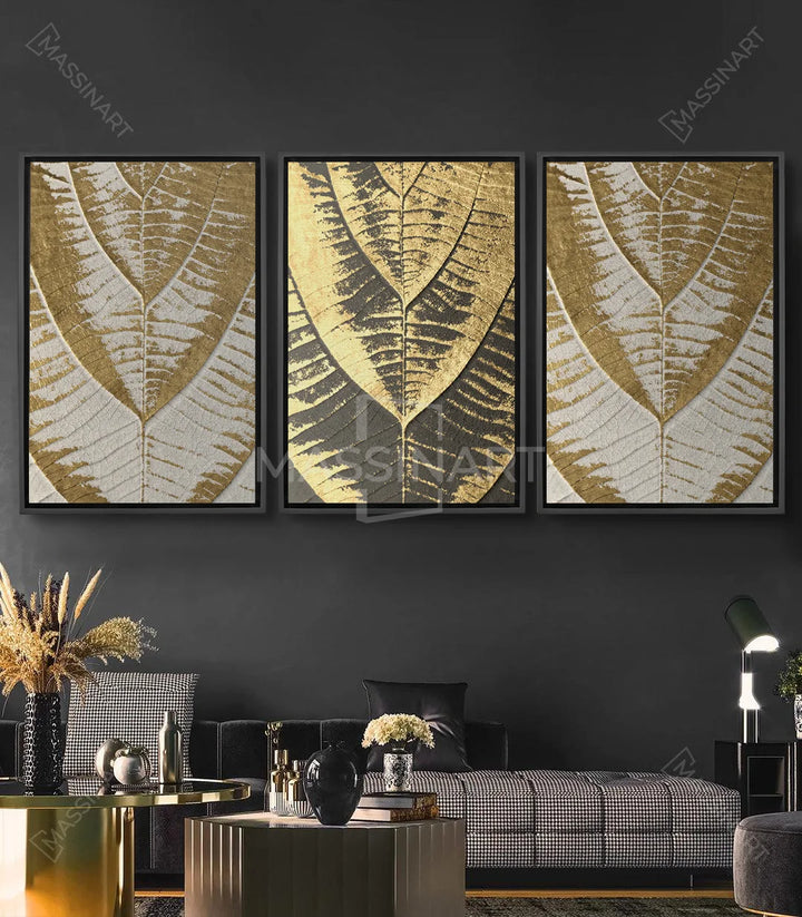 Cuadro Golden Leaves tríptico — hojas doradas con textura en relieve sobre fondo oscuro, arte mural decorativo Massinart