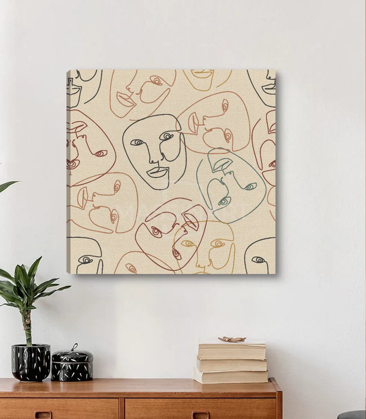 Cuadro Faces Massinart — decoración contemporánea sobre pared blanca