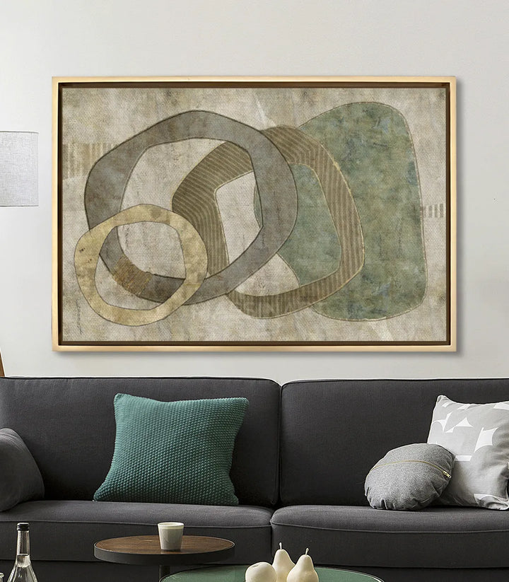 Cuadro Boho Oasis en salón moderno con sofá negro estilo contemporáneo Massinart