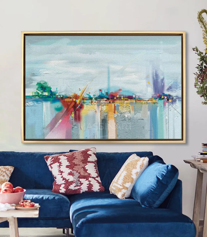 Cuadro paisaje abstracto decorando un salón moderno sobre sofá azul — Massinart