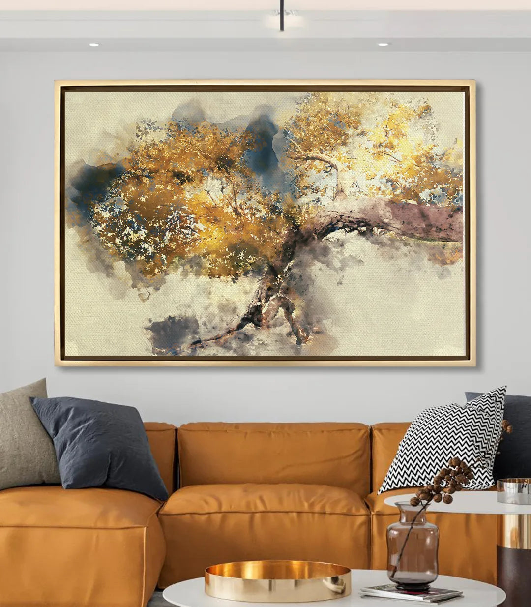 Ambientación Striving Branch — decoración salón moderno con sofá de piel y cuadro abstracto dorado