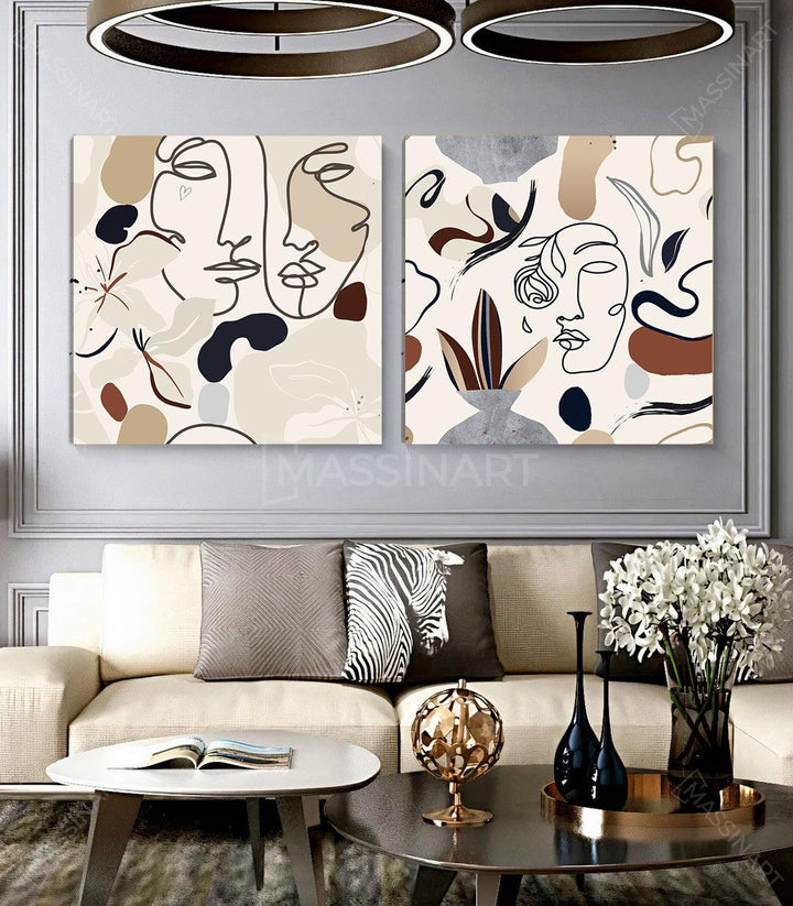 Cuadro Faces in Peony Flowers — díptico con rostros abstractos en trazo negro, flores y hojas estilizadas, tonos beige taupe gris — Massinart
