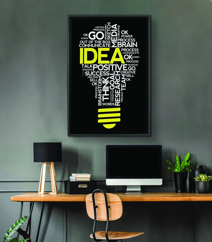 Cuadro decorativo bombilla Idea — composición tipográfica minimalista en negro sobre fondo neutro